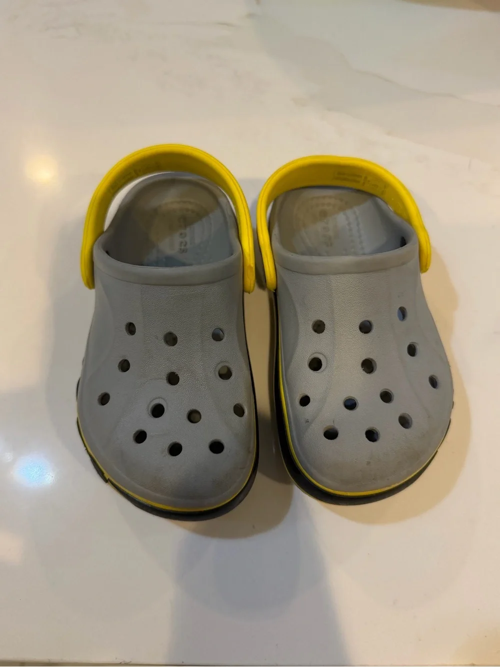 CROCS Kids Gray Clogs with Yellow Heel Strap